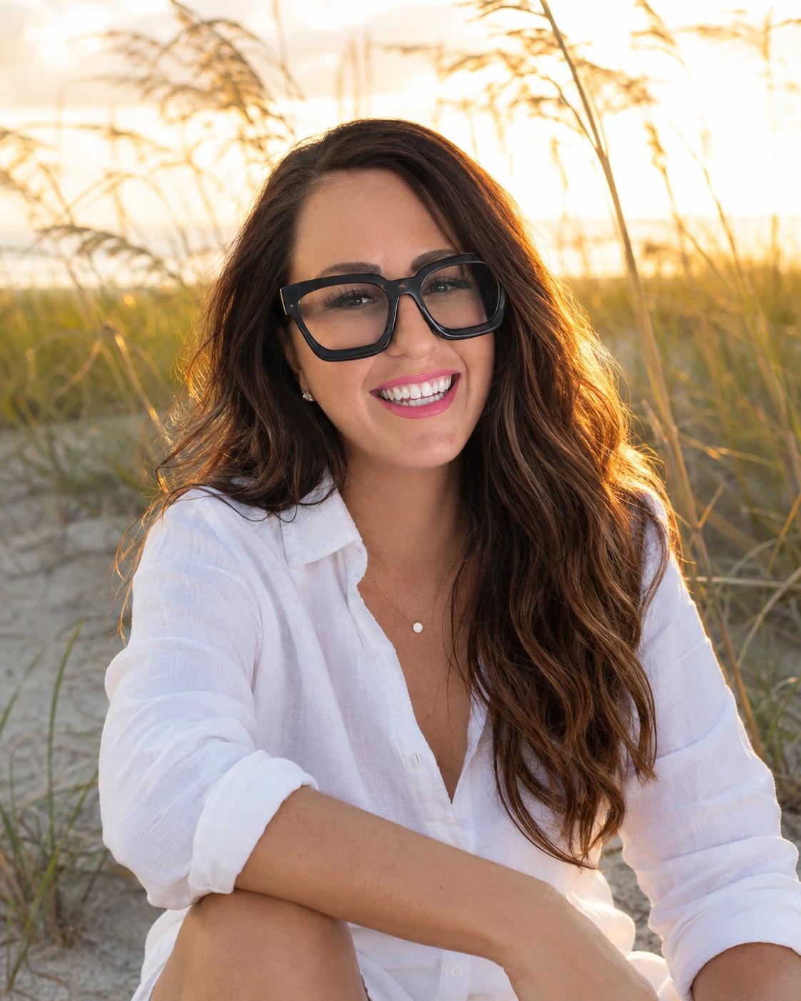 Portrait beside beach grasses