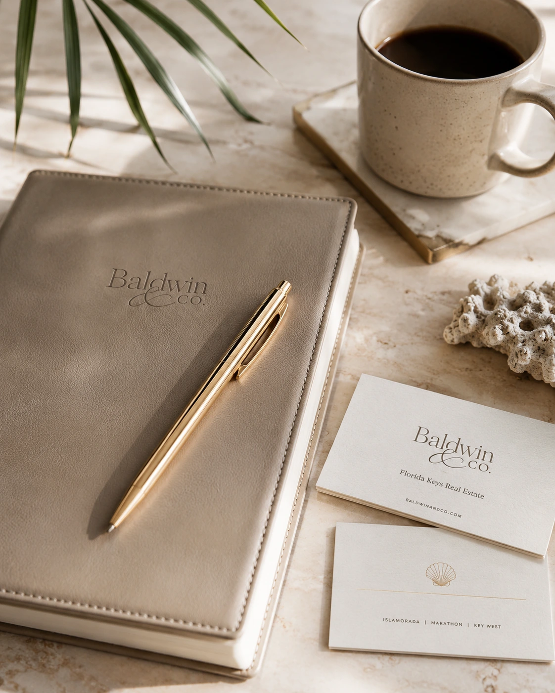 Baldwin & Co. notebook, coffee, and stationery